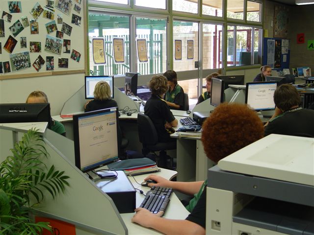 students on desktops in resource centre